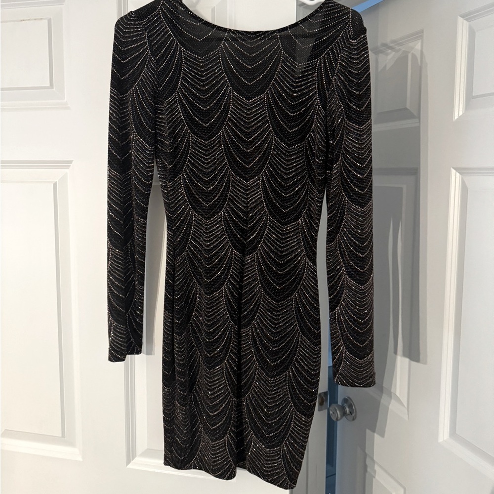 Long sleeve, statement back cocktail dress!